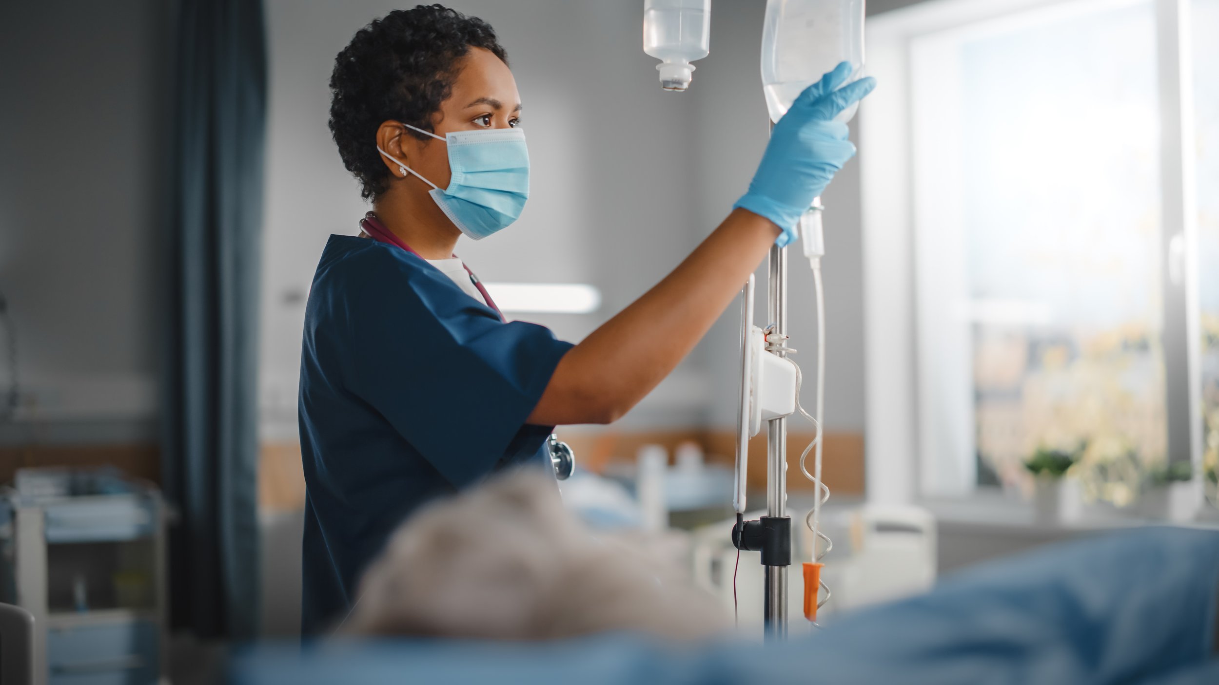 Infusion Nurse helping patient