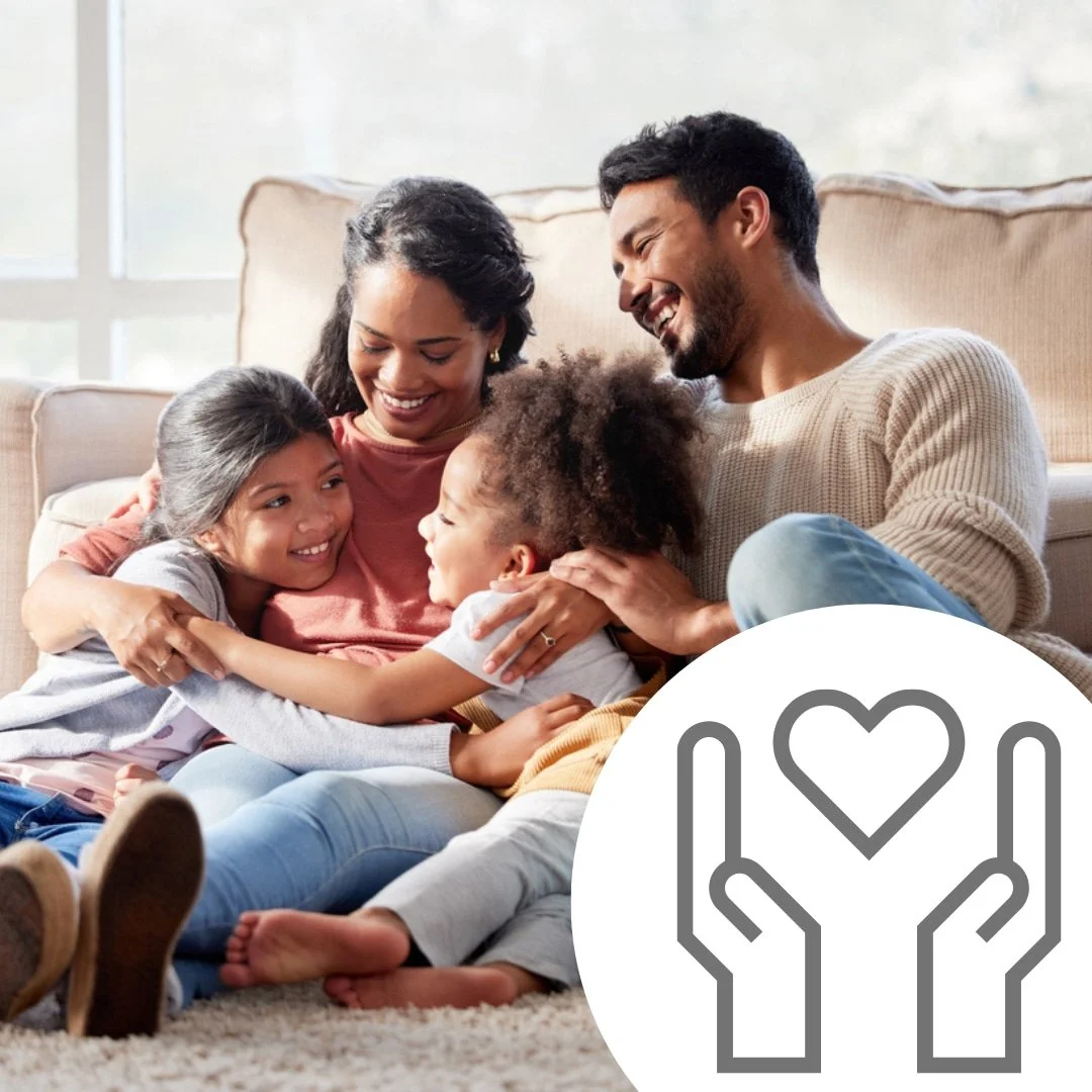 A happy family sits on a couch, smiling and hugging, with an icon of hands holding a heart in the foreground.