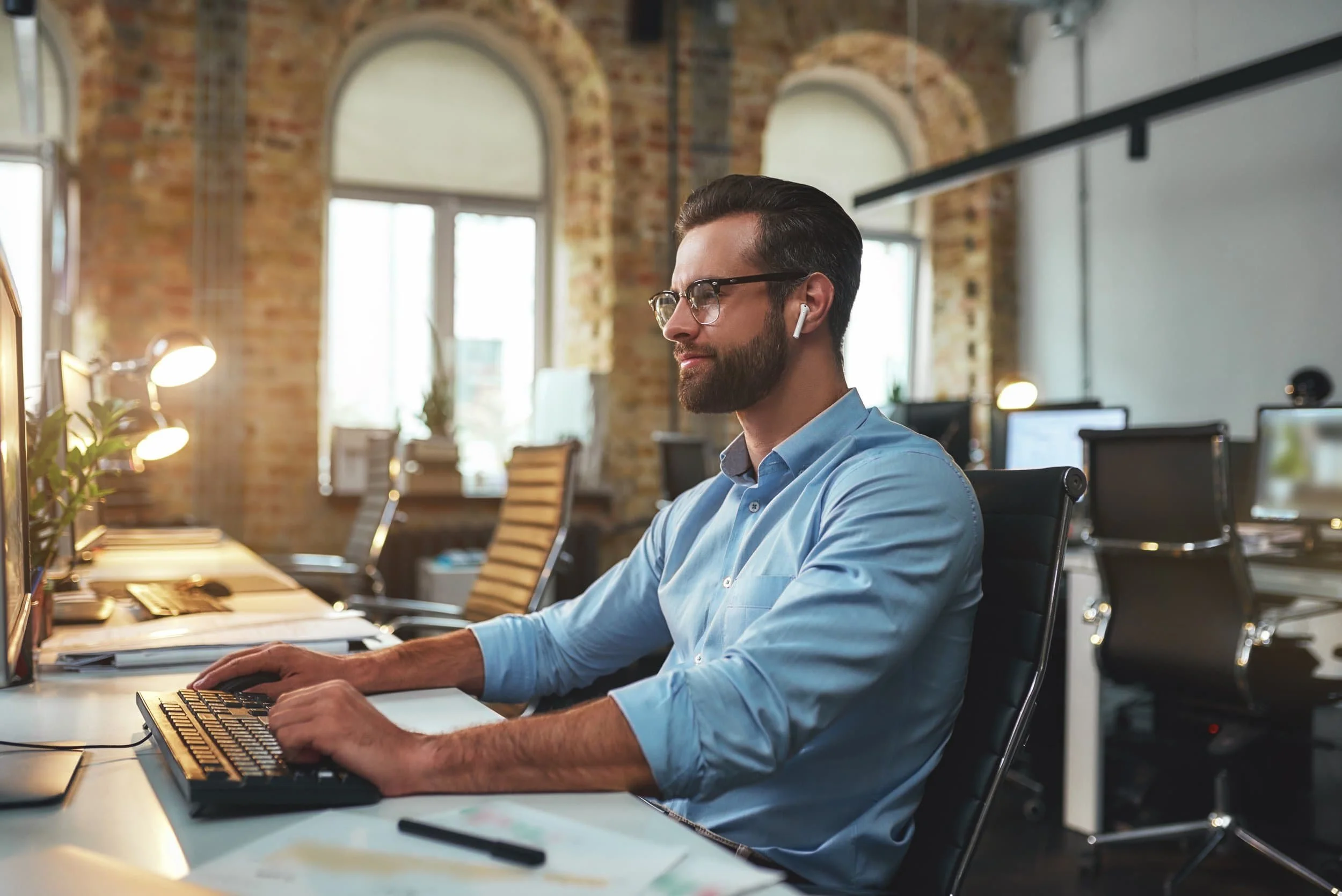 Man sitting at desk image