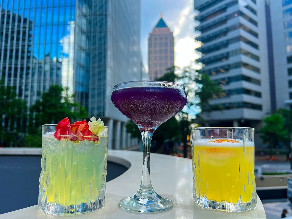 A Sip Of Cocktail At A Rooftop Bar