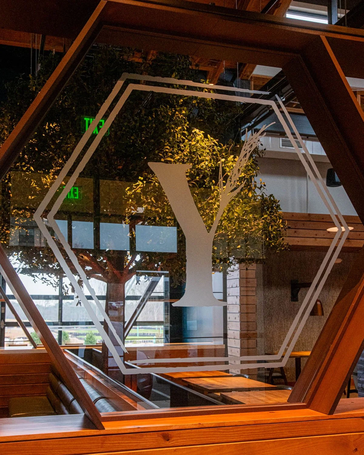 YAVA Kitchen and Brewhouse logo on glass. Photo credit: Grub Freaks