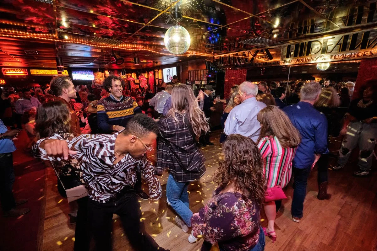 People dancing on the dance floor at Johnny's Hideaway. Photo credit: Brandon Amato - www.brandonjohnamato.com
