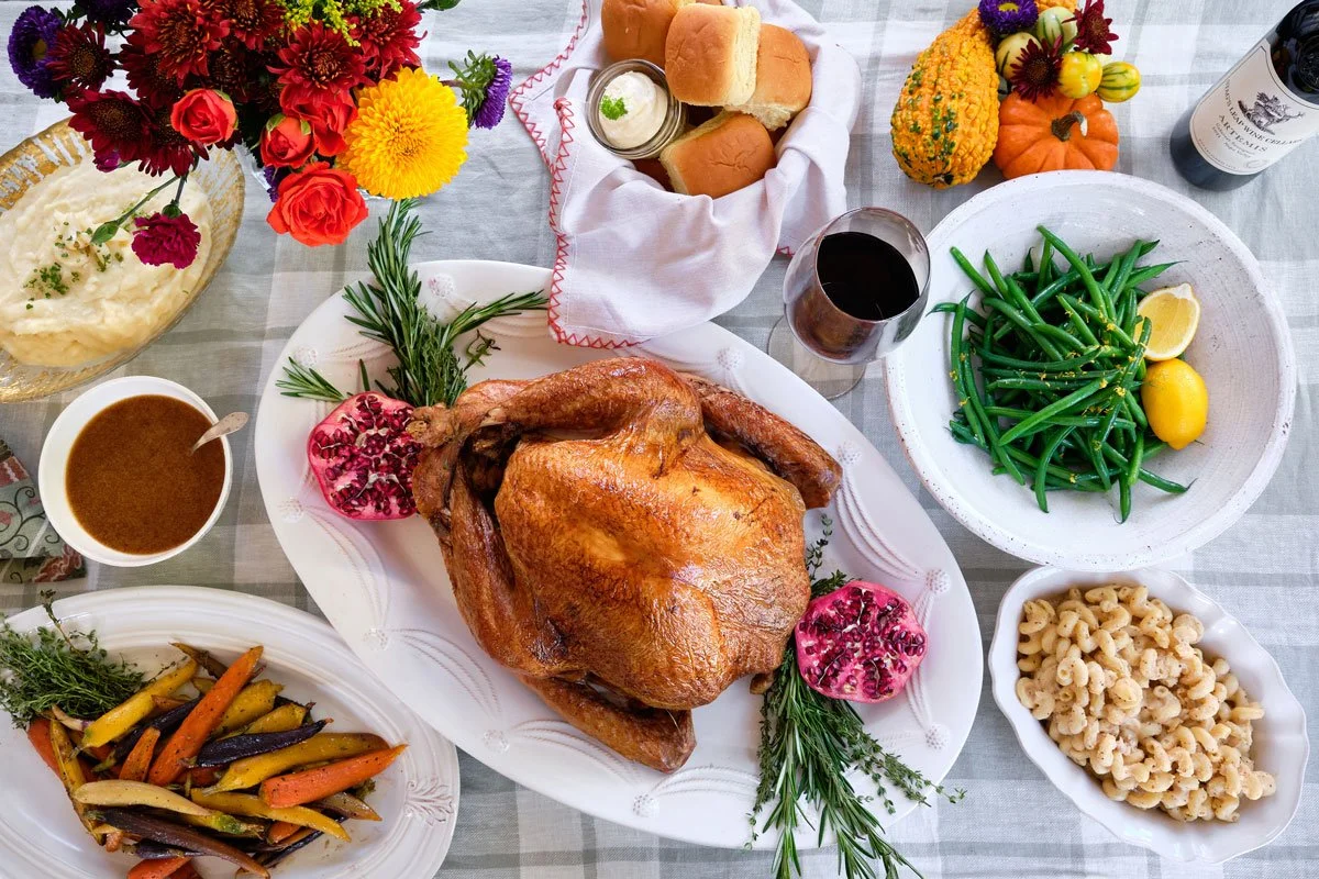 A spread of Thanksgiving dishes and wine on a table at Milton's. Photo credit: Brandon Amato - www.brandonjohnamato.com