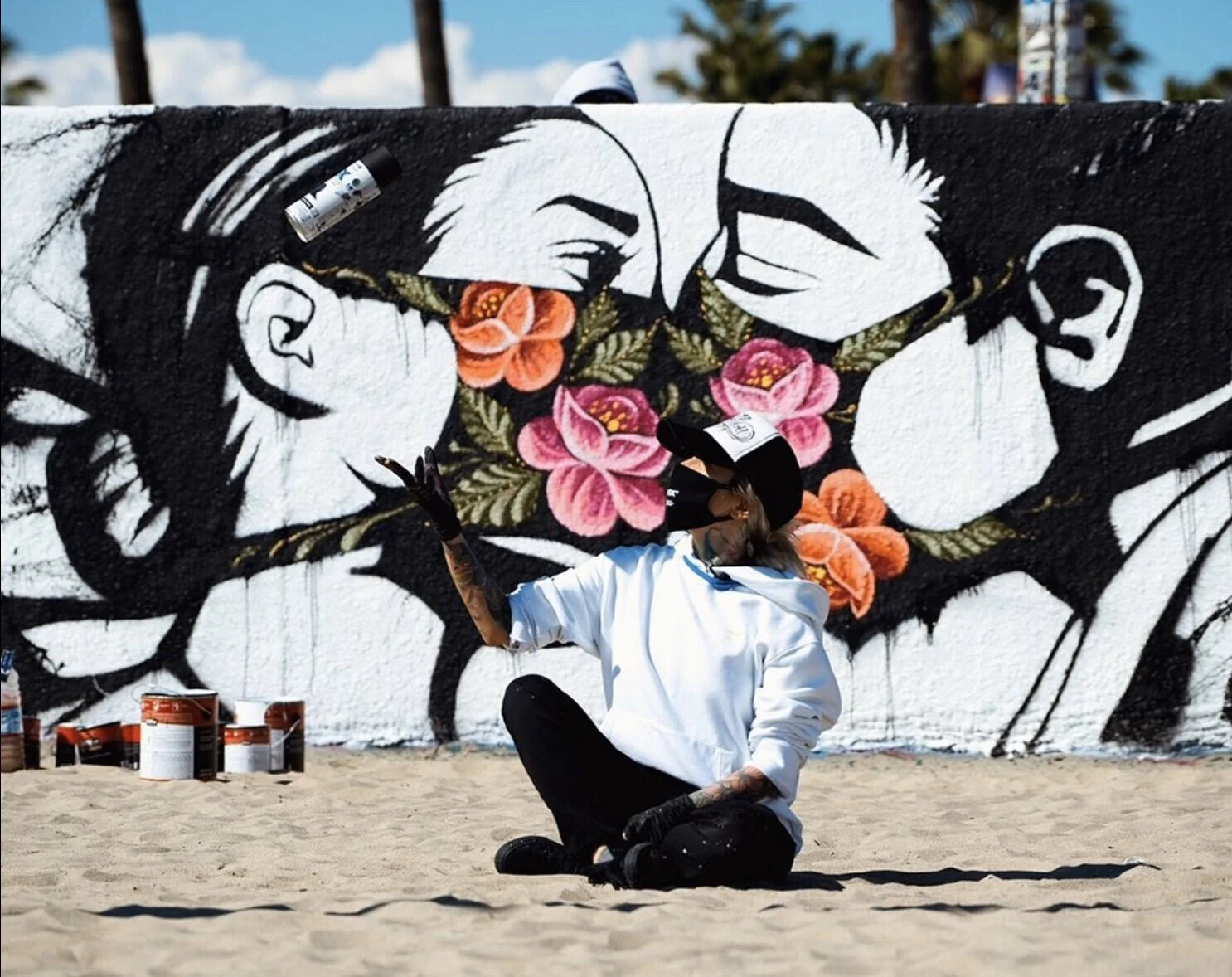 Pony Wave, Stay Safe, 2020, Temporary Mural on Venice Beach Boardwalk, Los Angeles, CA. Artist in foreground.  Image Credit: Pony Wave Instagram