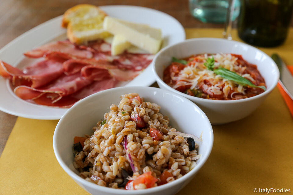 Tuscan specialties: charcuterie, Pappa al Pomodoro, and Farro Salad