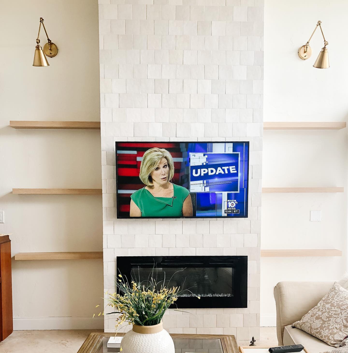 When the news finally gets it right 😂 (had to) Update indeed!! Just installed these custom wood beauties over at #clientmamagetsanupgrade for all the shelfie love to come. You guys, this 2 story tall fireplace tiled in gorgeous @bedrosianstile is su