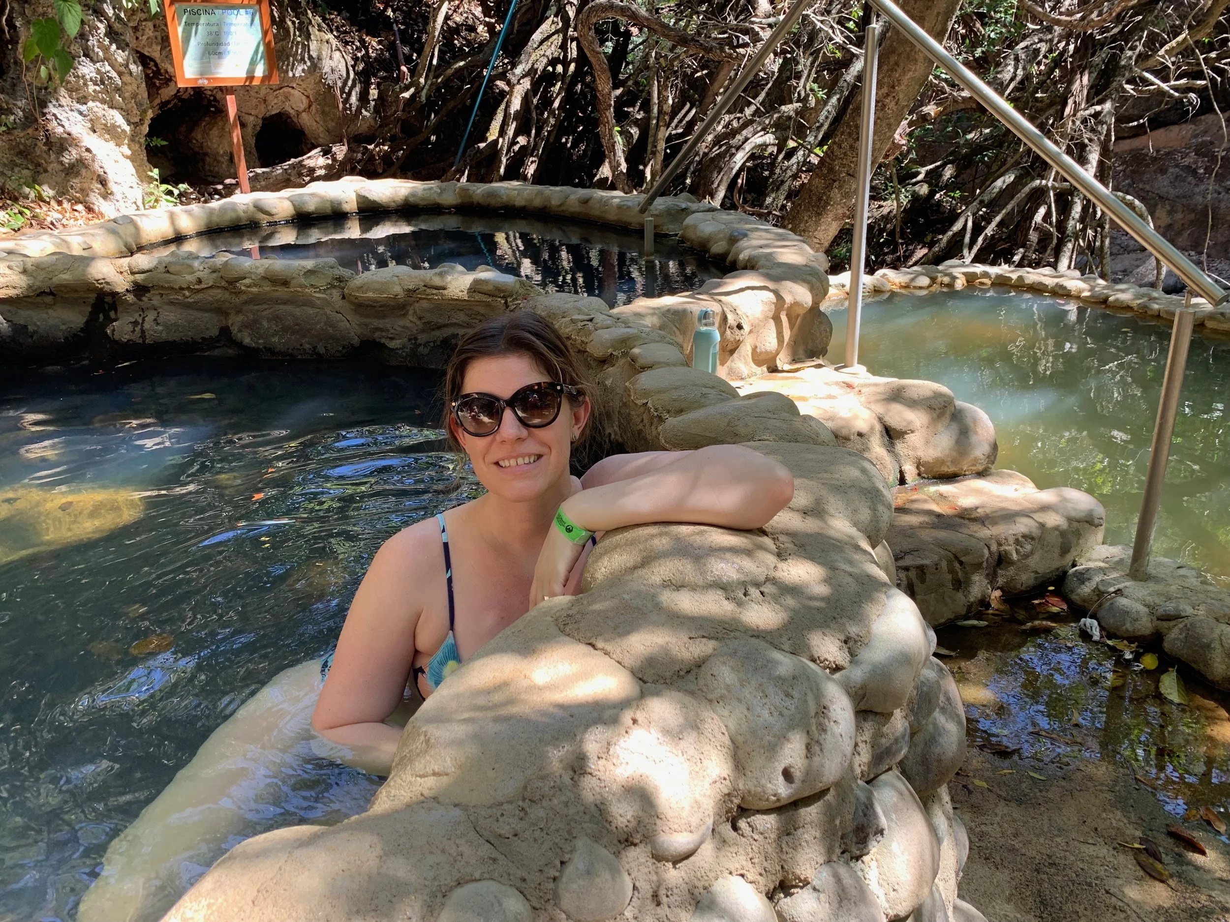 Women soaking in rio negro hot springs in Costa Rica