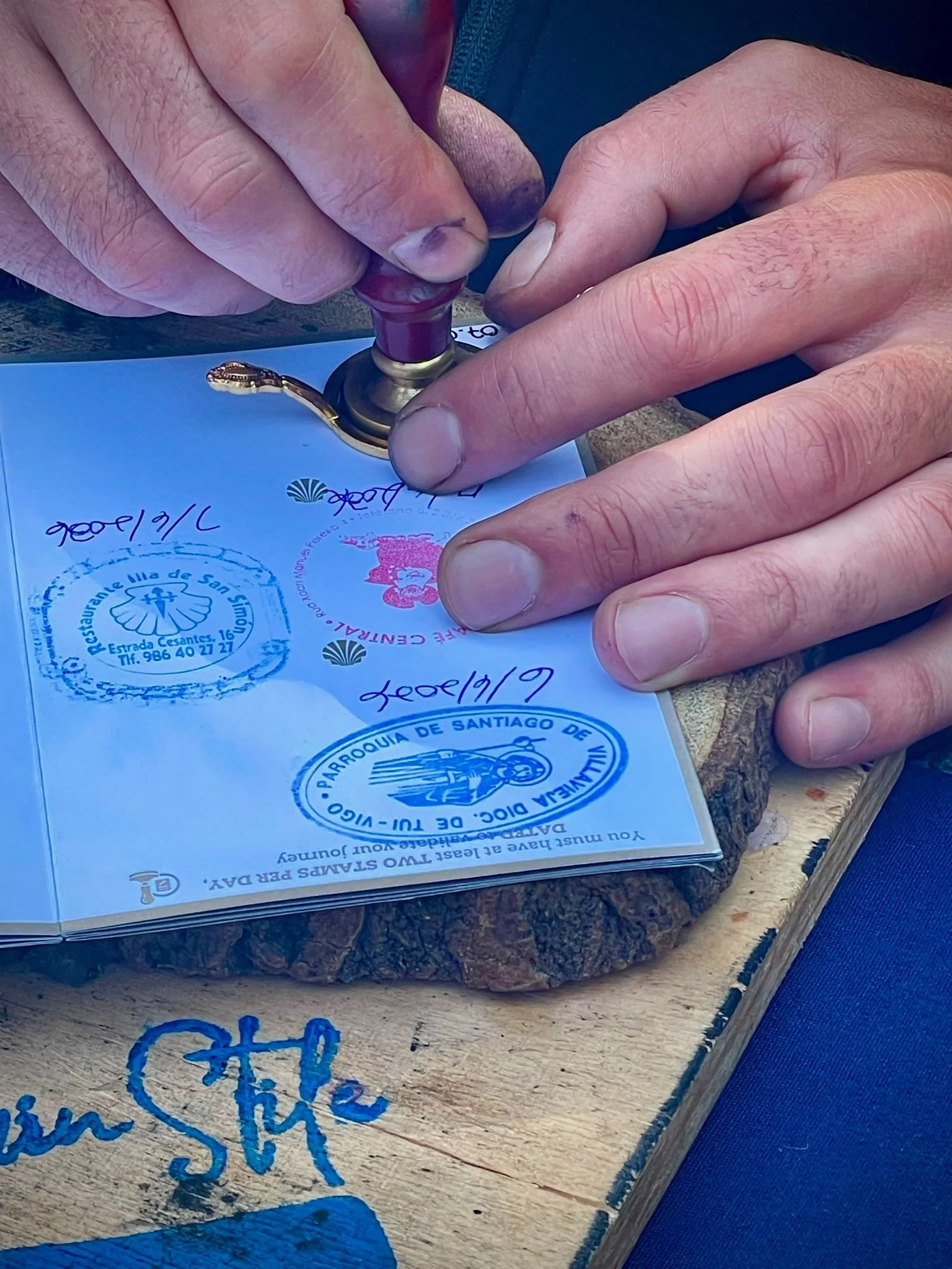 getting a stamp on the camino portuguese guided Camino trip for solo female travelers.jpeg