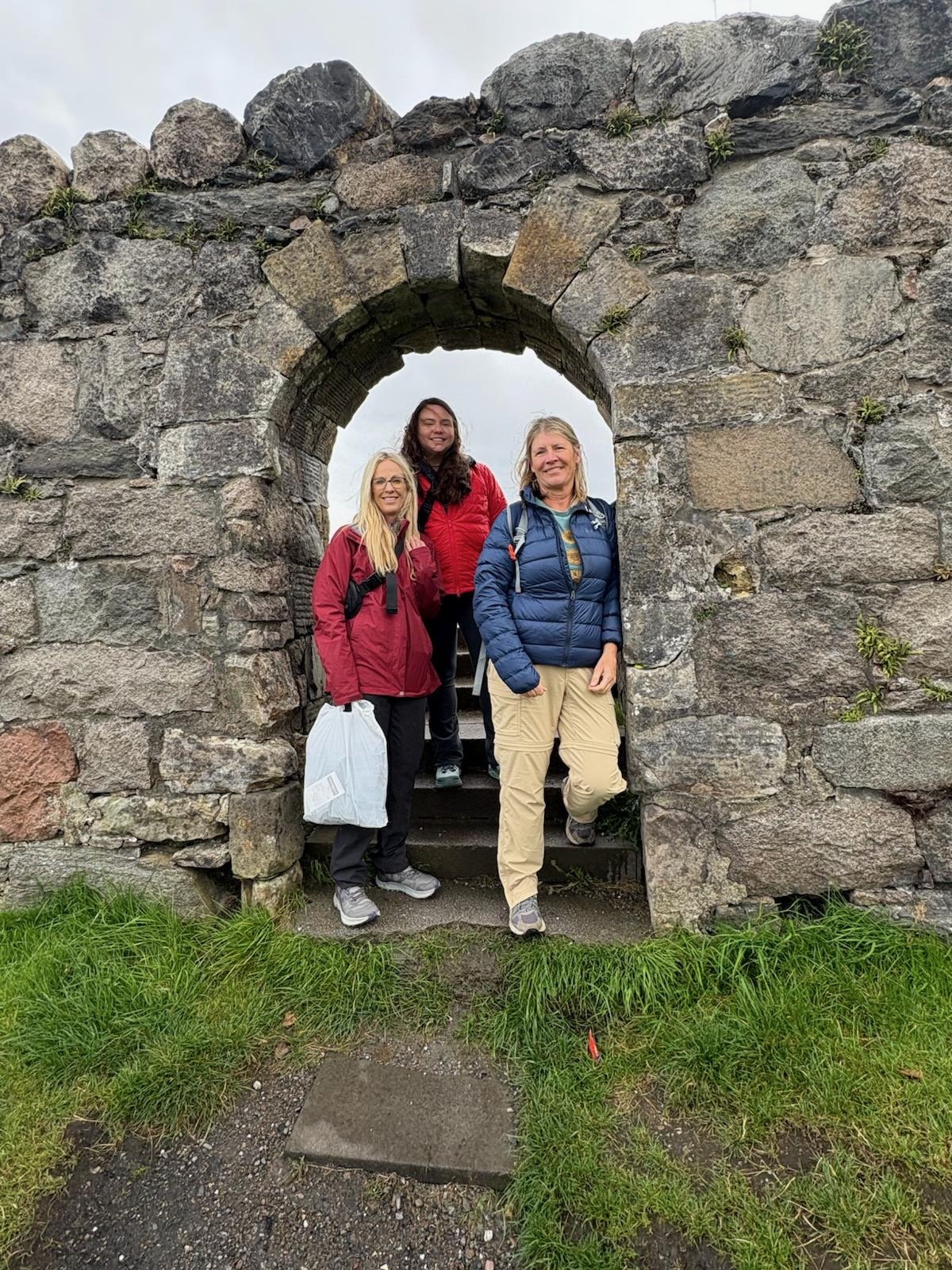 Women exploring a medieval castle in Scotland