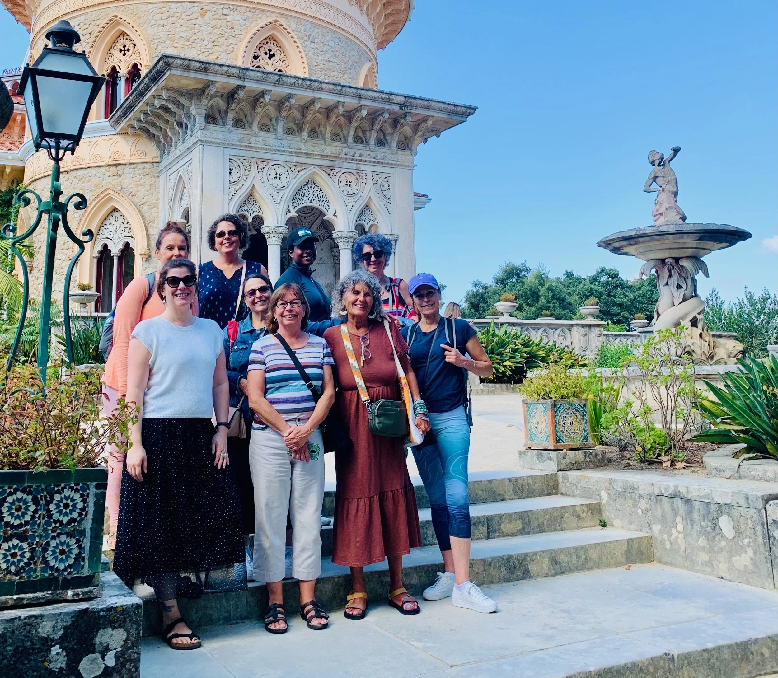 Group of solo women travelers in front of landmark in Sintra Portugal