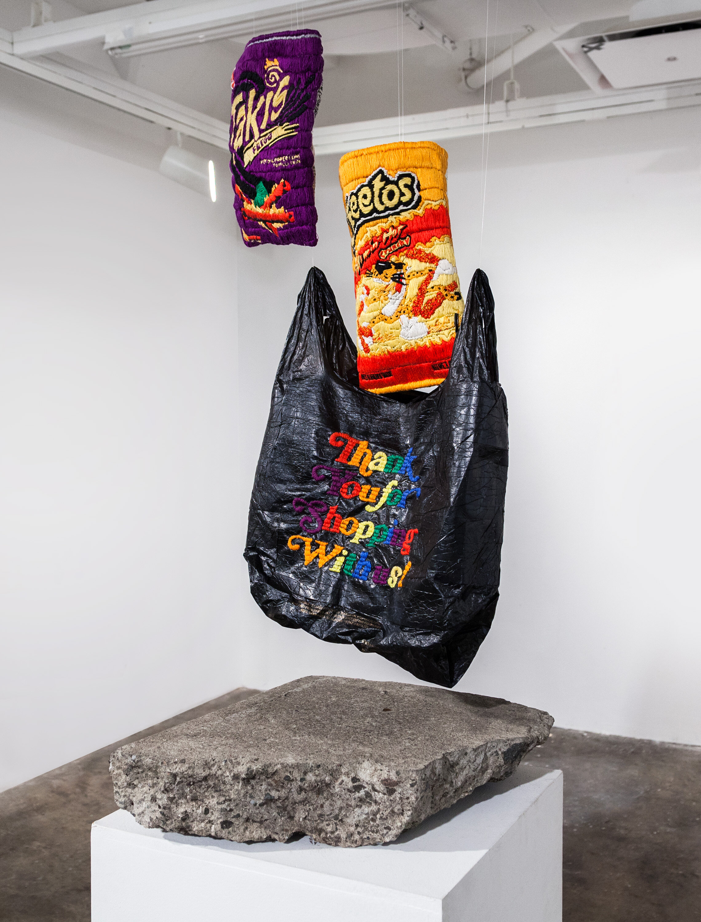 "Resurrection of the Disposable Object", hand embroidered Hot Cheetos and Takis, Hand embroidered plastic bag, sidewalk, size varies, 2016