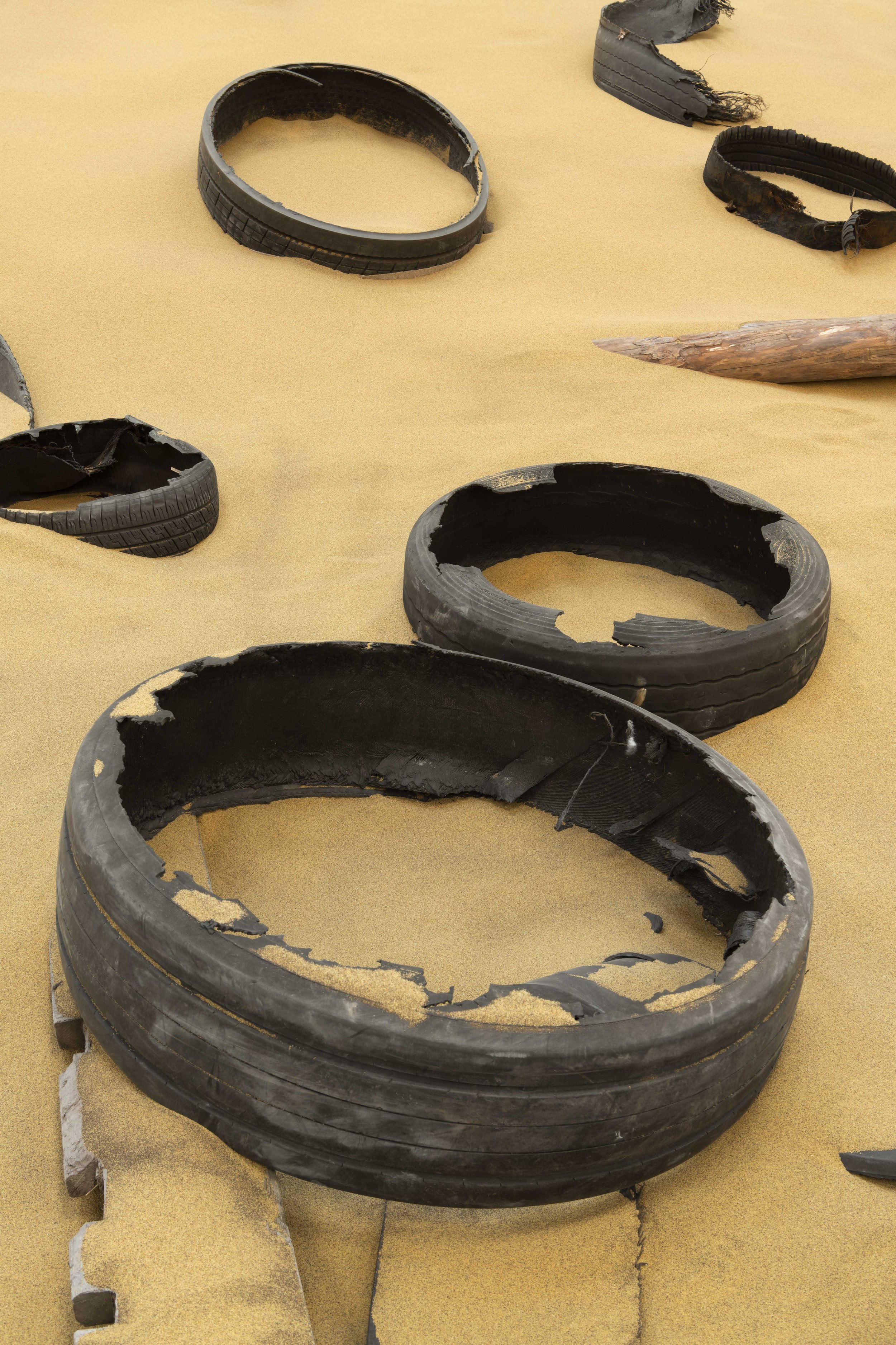 Installation view of Mike Nelson, Triple Bluff Canyon (the woodshed), 2004. Various materials. M25, 2023. Found tyres. Photo_ Matt Greenwood. Courtesy the artist and the Hayward Gallery (5).jpg
