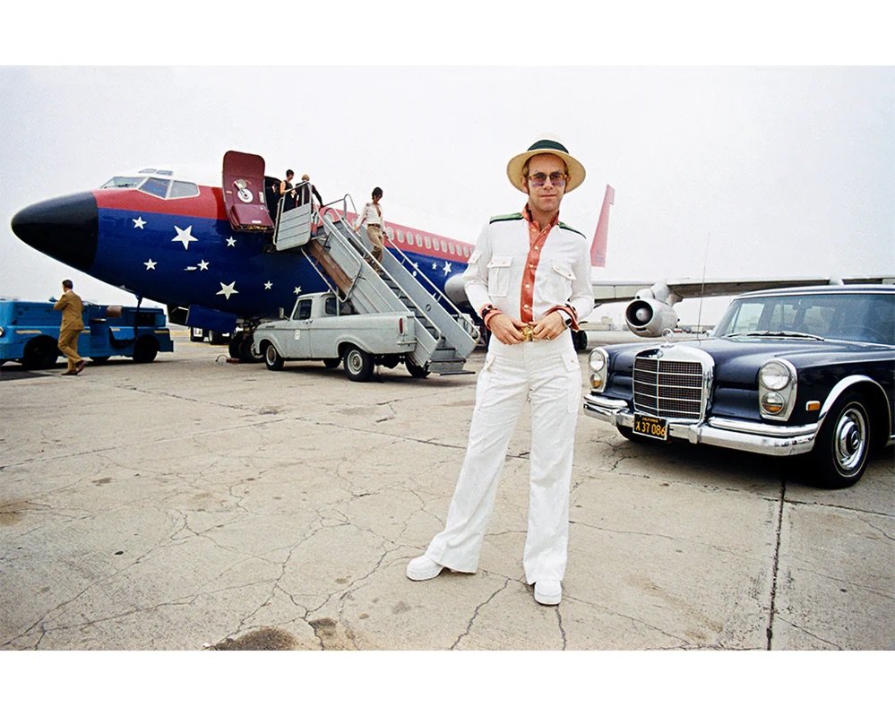 Terry O’Neill, Elton John with his private plane, 1974.