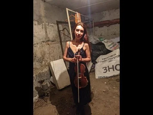 Violinist in the Bomb Shelter