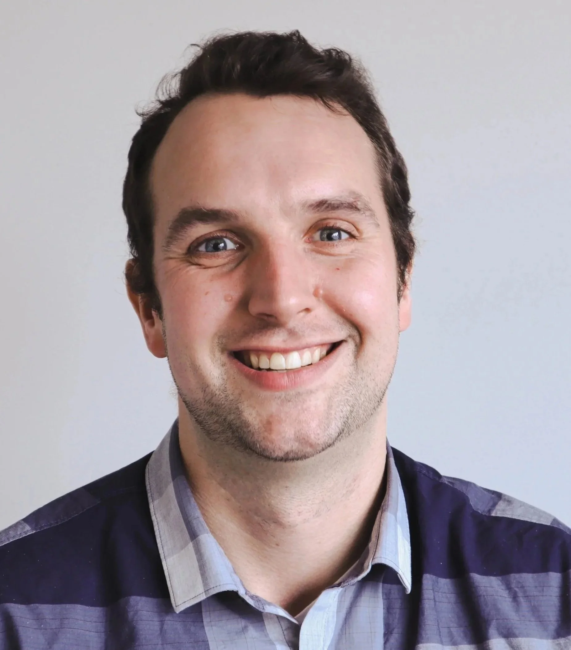 James Franey, Director of Procurement at JAK’s, professional headshot smiling in front of a neutral background.