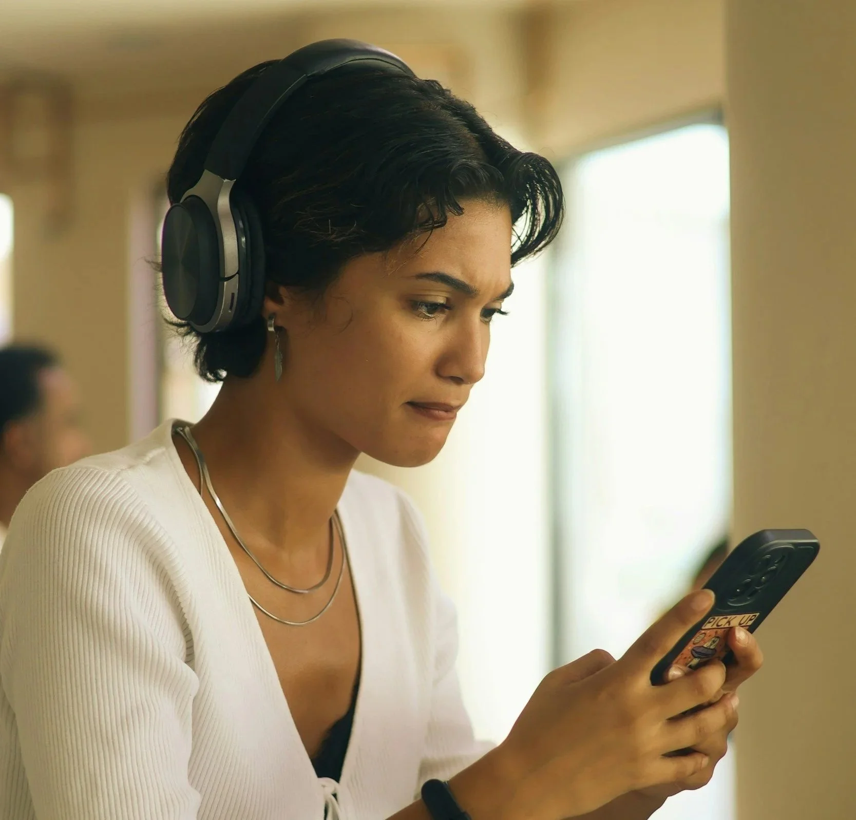 Woman looking confused at her phone