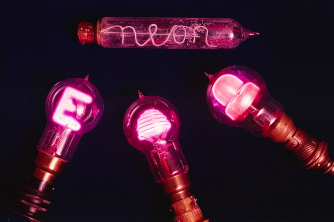  Four of the earliest neon lights are shown here (counter-clockwise from top) and include a neon lamp of about 1922; an Osram `Glimmelamp'; a lamp shaped to show a letter 'E'; and a beehive-type neon lamp.  