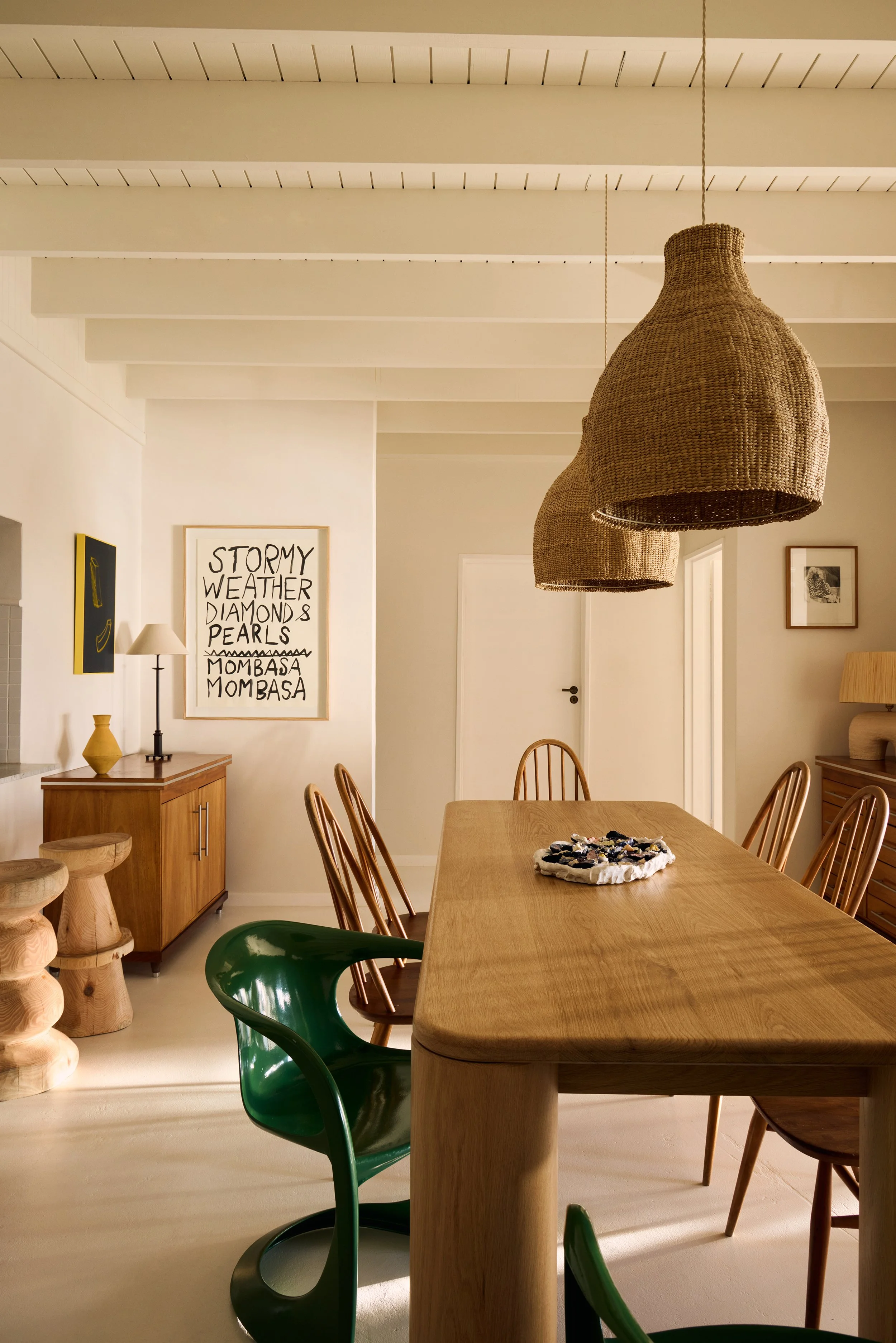 Antique treasures and monastic pieces sit alongside bespoke furnishings, brought to life with richly textured fabrics. Every detail feels intentional yet unforced—collected rather than decorated, warm rather than polished.