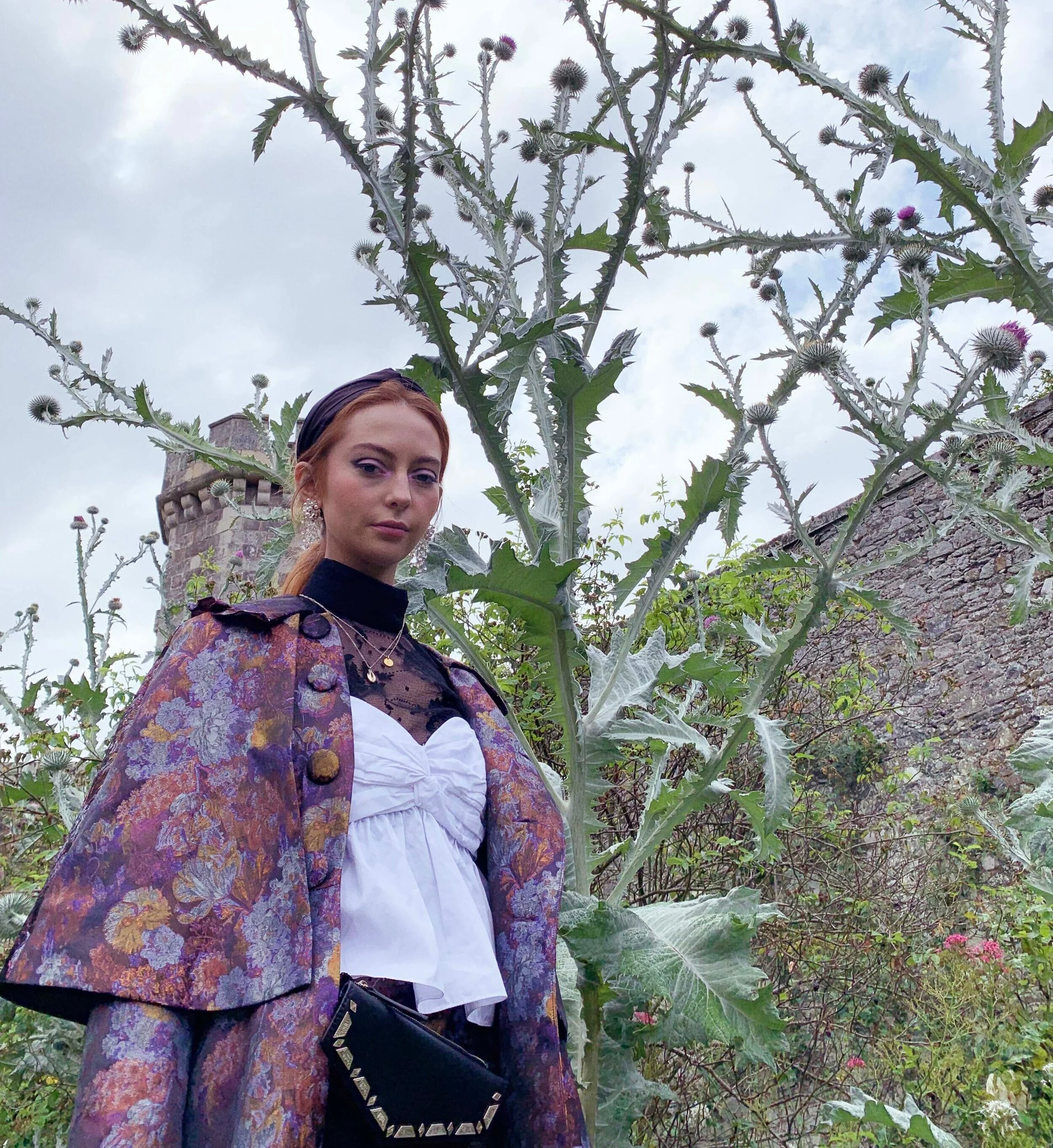 Logan in Scotland wearing the Witchery Coat in Brocade