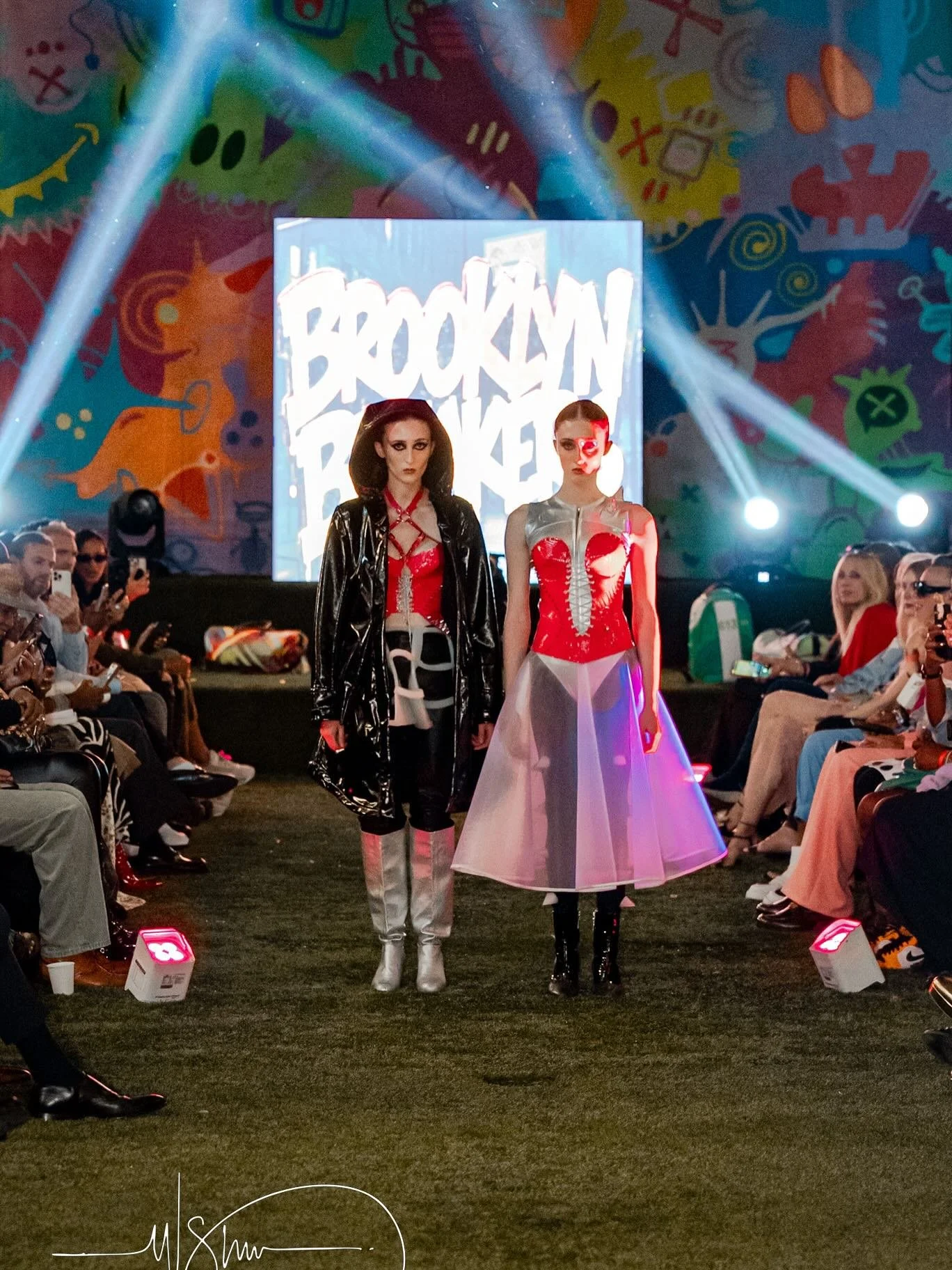 The F/W 2025 &lsquo;Dark Knightress&rsquo; silicone mesh skirt on the left and the silver bodysuit with removable silicone shoulder inserts and black tights underneath with spikes.

Runway photography: @wesleysherow 
Backstage photography: @dianeallf