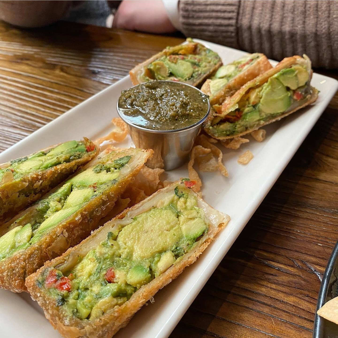 The &ldquo;Avocado Eggrolls&rdquo; are made with fresh avocados, sun dried tomatoes, cilantro; wrapped in a crispy eggroll, served with tamarind cashew sauce!