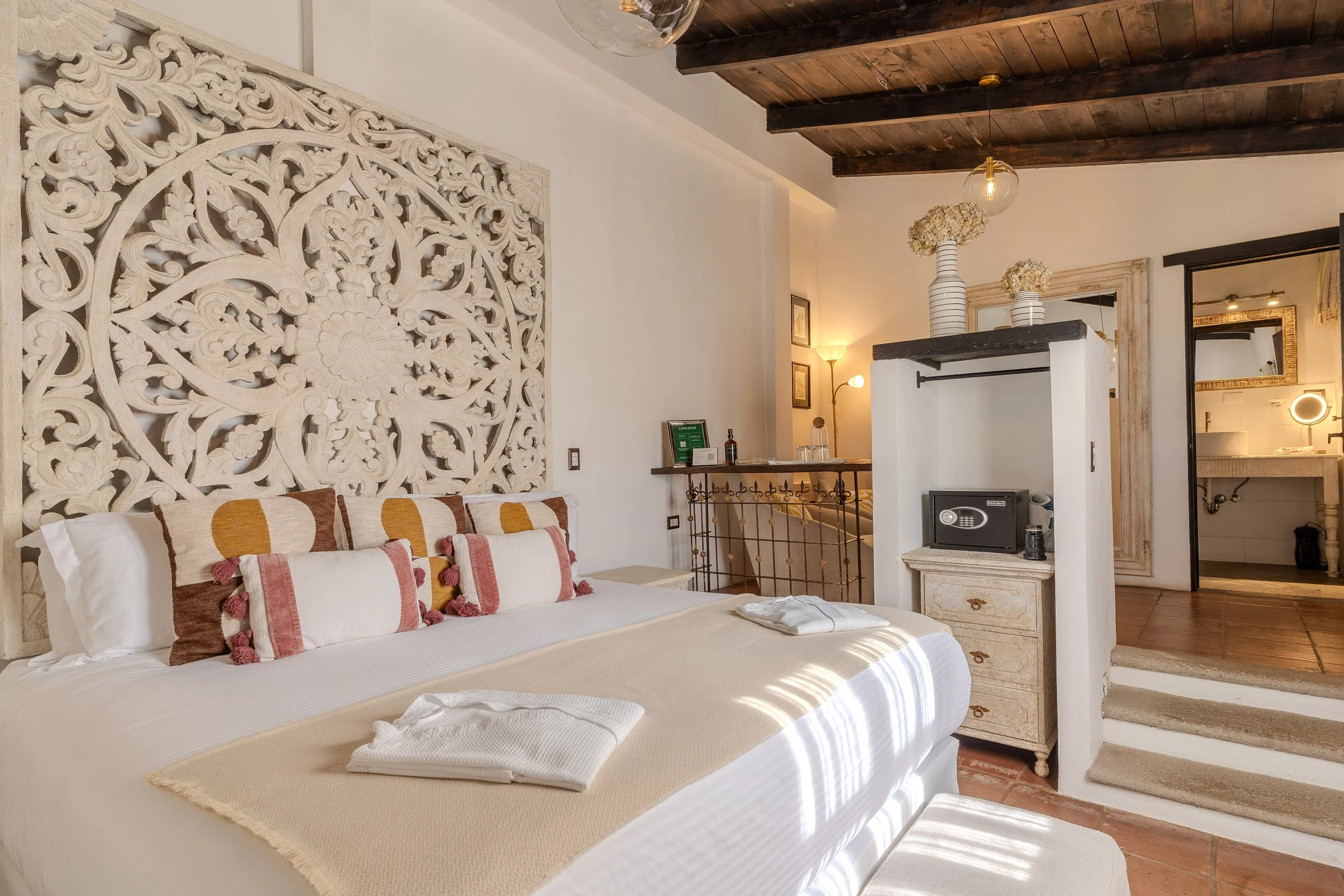 A view of an elegant master suite at Conceptio Antigua Guatemala