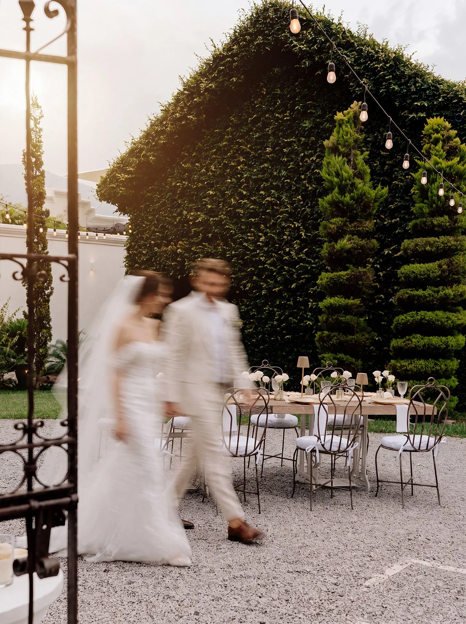 A wedding couple walking past their luxury reception in Conceptio Antigua