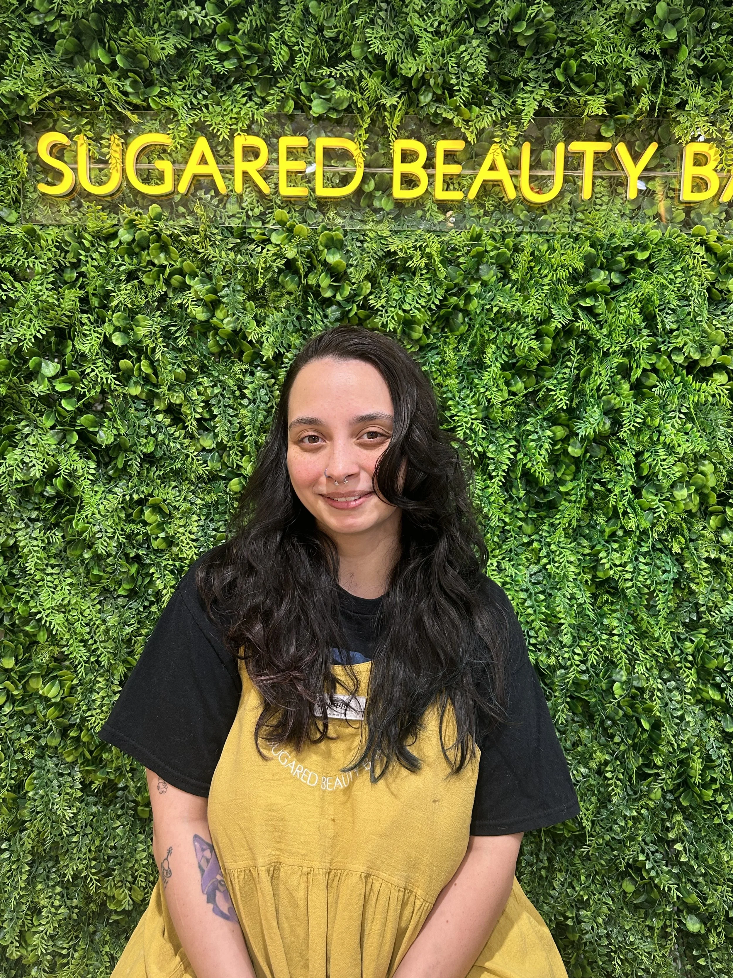 Man with glasses and beard wearing a dark knit sweater