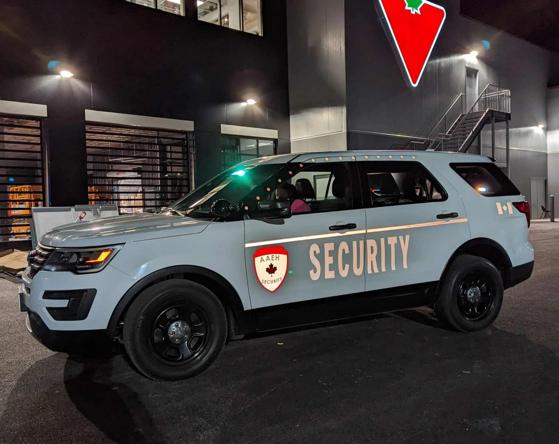 Security patrol vehicle monitoring isolated rural roads and farmland in Rockton Ontario at night