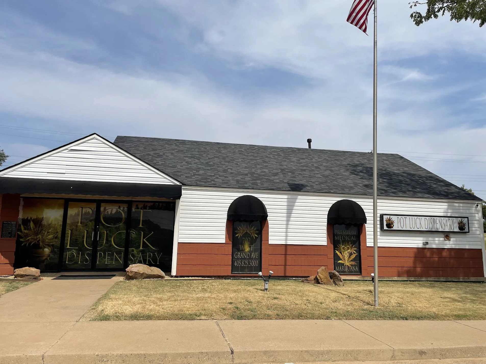 PLD702 FRONT OF BUILDING WITH FLAG.jpeg