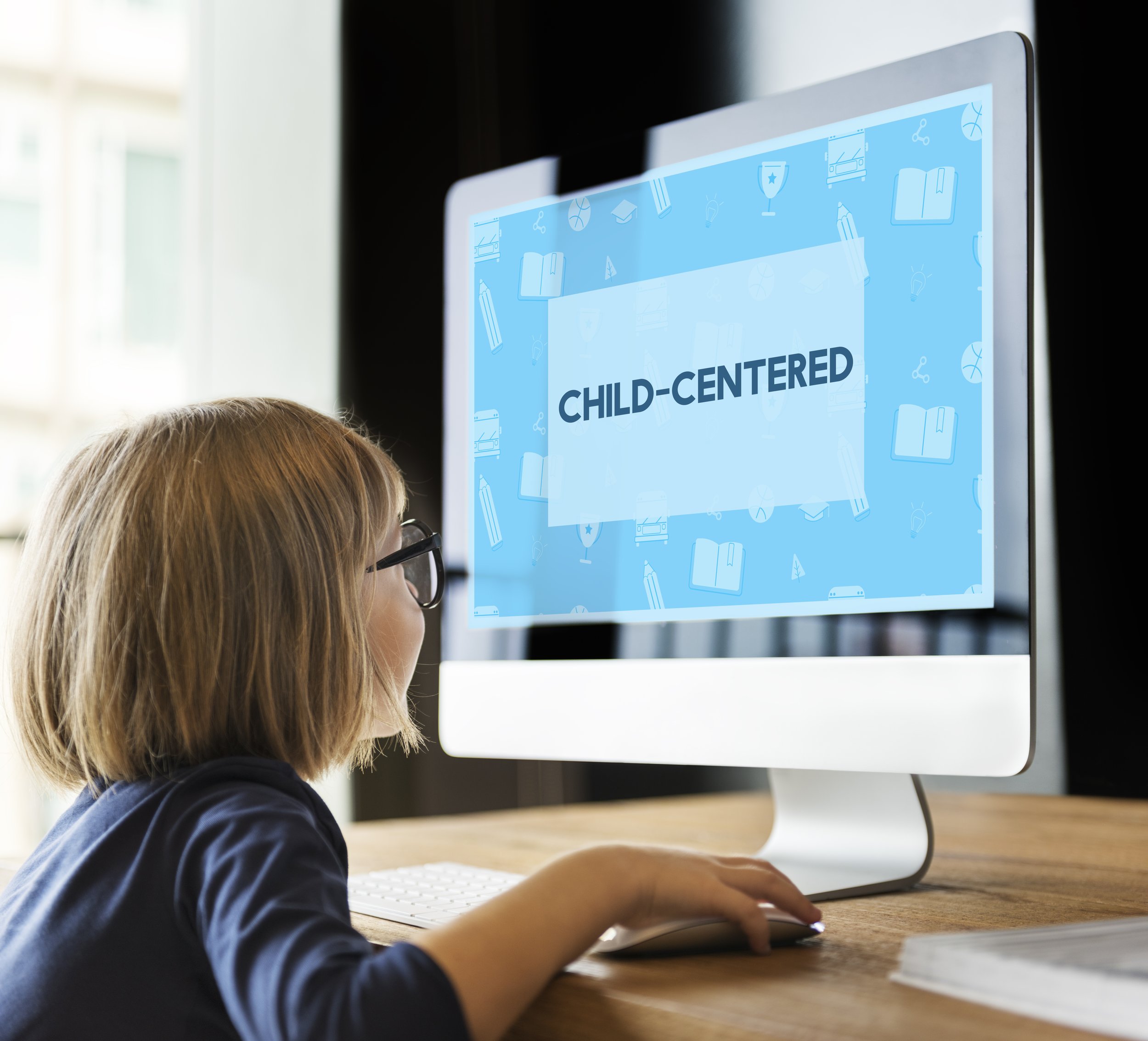 Child engaged in a child-centered online speech therapy session during a virtual appointment.