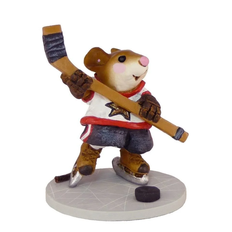 a mouse playing ice hockey