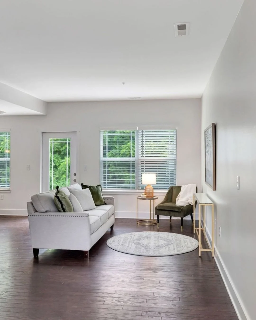 The home I&rsquo;d buy if I wanted every box checked.

Hardwood floors in the main living area.
Two-car garage.
Bright white walls.
Natural light pouring in.
A functional layout with real storage.
Outdoor space that backs up to nature &mdash; not ano