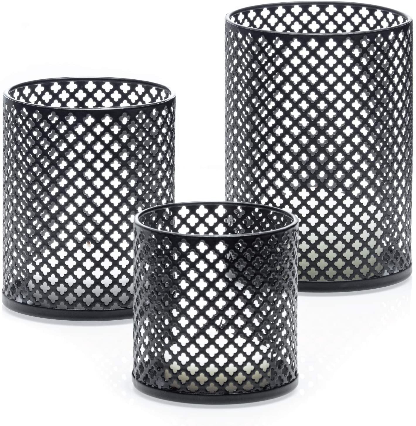 Moroccan style pillar candle holders with punched metal quatrefoils