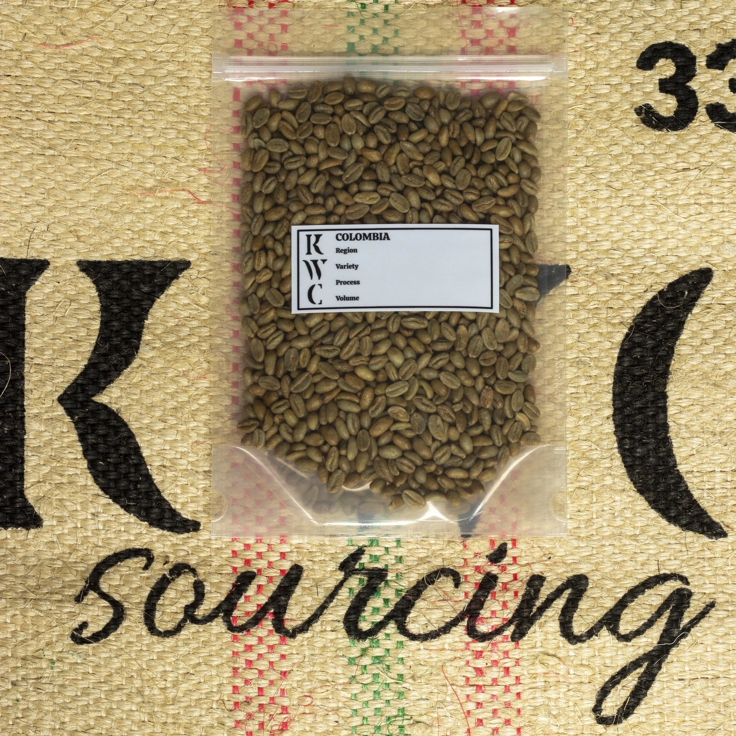Premium green specialty coffee sample on jute bag featuring KWC Coffee, highlighting Colombian green coffee export and import and white label roasting