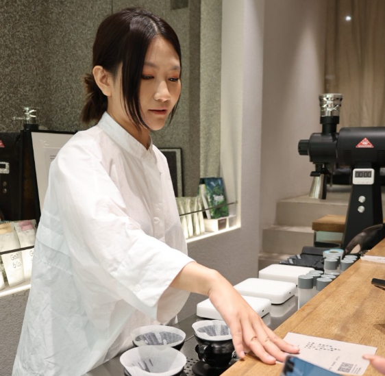 Portrait of Know Where Coffee team member, Zita Zheng - Director and Logistics Manager of Know Where Coffee China and specialty coffee marketing across Asia