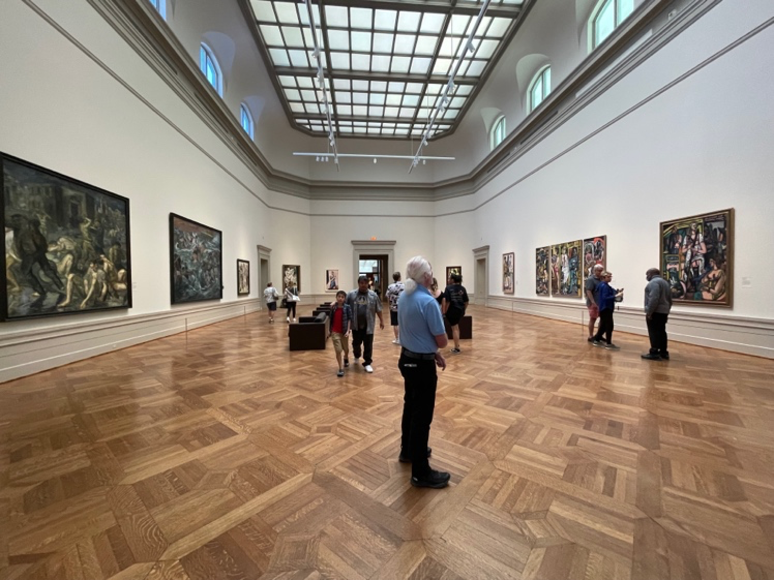 photograph of viewers in art gallery