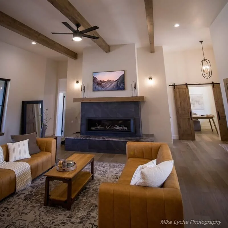 Mantle, coffee tables, and ceiling beams features in COBA Tour of Homes