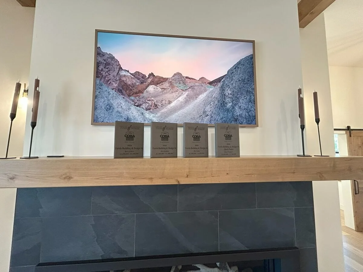COBA Tour of Home awards sitting on Frank's custom mantel