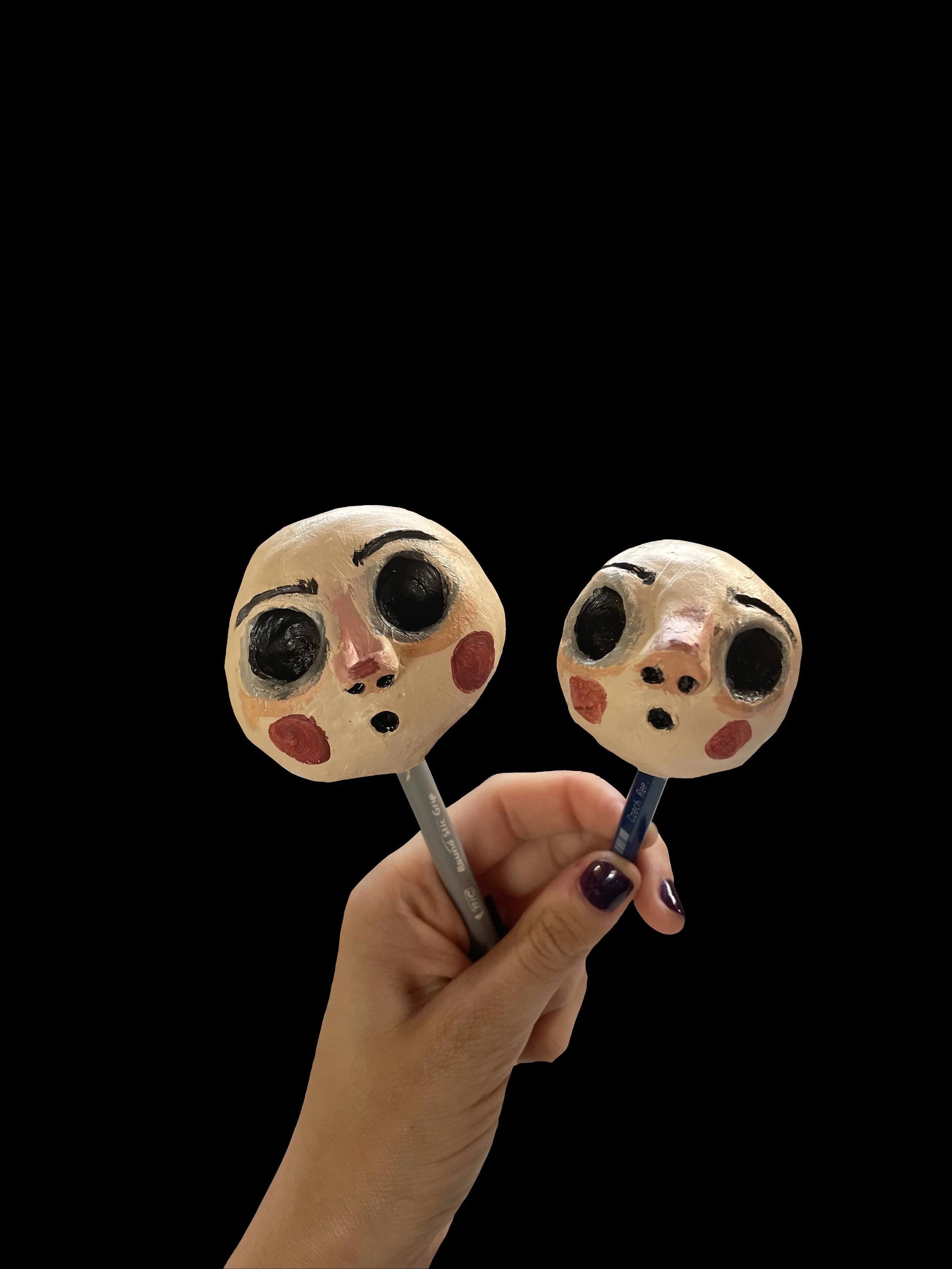 Puppet heads on stick.JPG