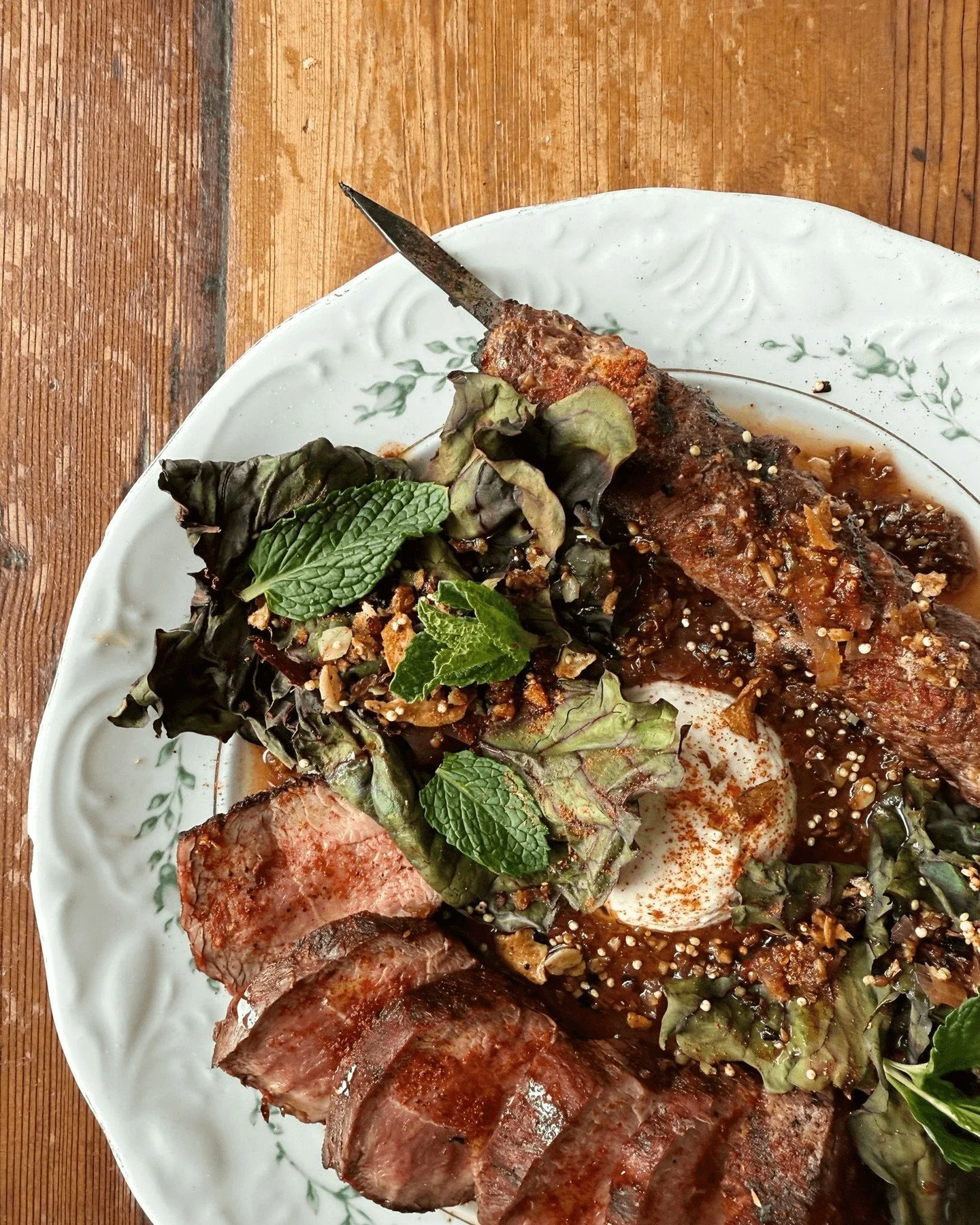As we enter into the (hopefully!) last stretch of winter, we have given some of our menu items a little ✨refresh✨ 

Pictured here is our grilled lamb leg &amp; kebab w/ baharat, grilled chard, fermented smoked cherries, sunchoke &amp; roasted garlic 