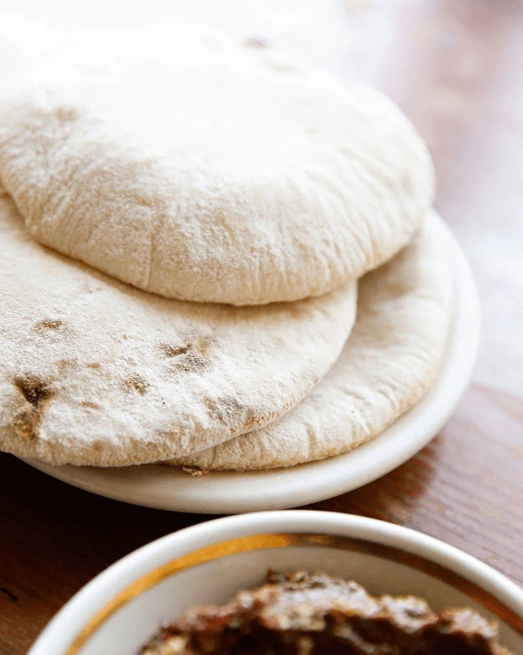 Our pillowy pita and buckwheat sourdough - all naturally leavened, made fresh, every day. 💕 ✨ 

Bread has a mind of its own. You can follow the exact same steps day after day, measure everything precisely, and still each loaf (or pita) will turn out