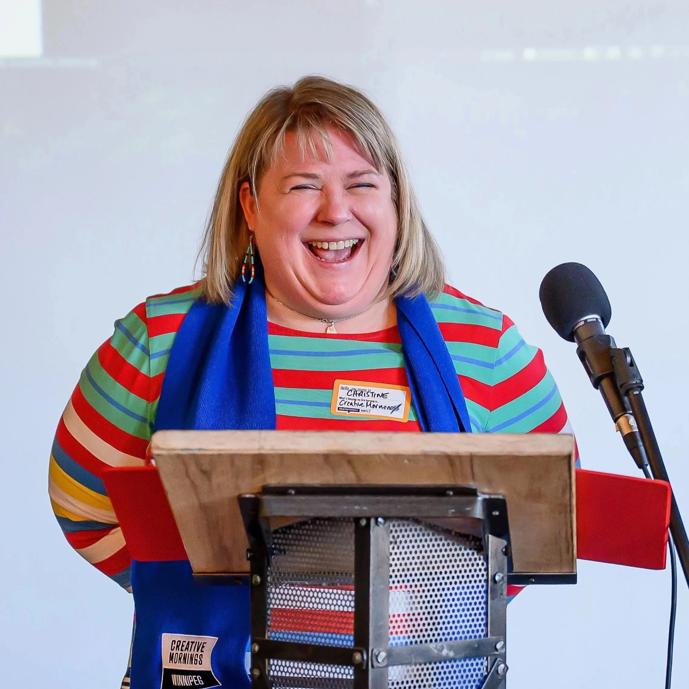 Dr. Christine Watson Speaking into Microphone
