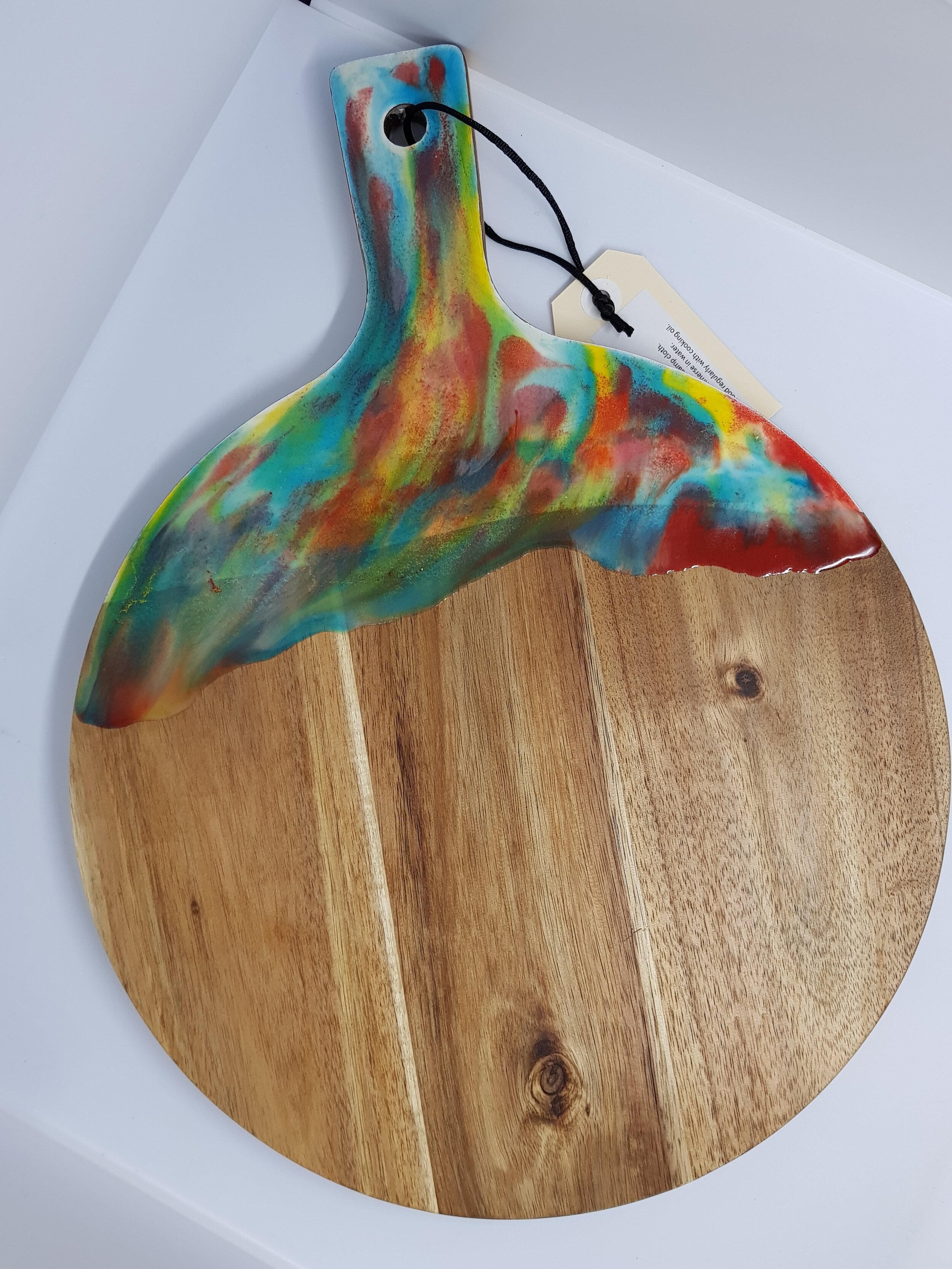 Acacia serving paddle with resin handle.