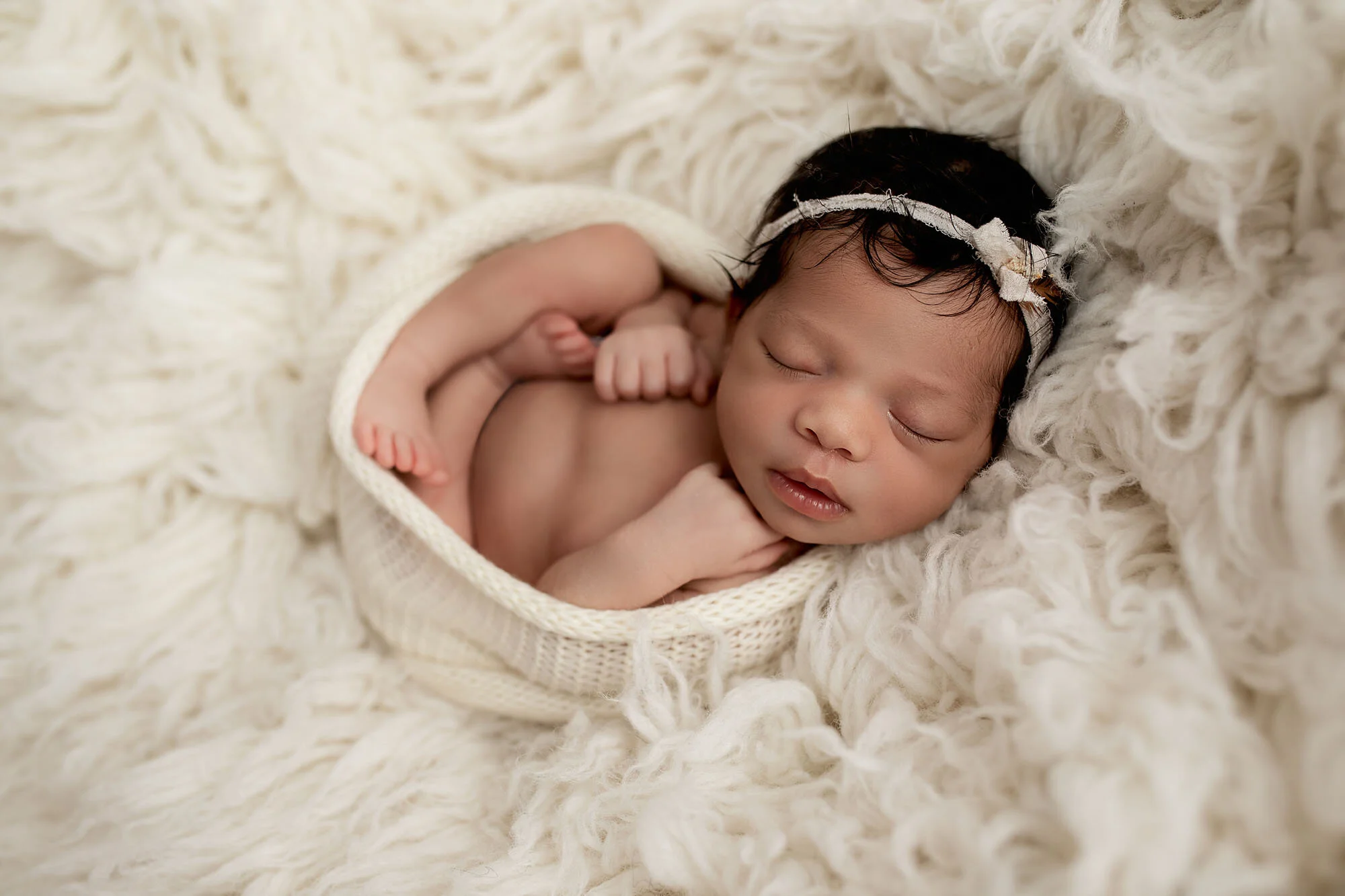 best newborn photographer daniela dagostino milton halton toronto baby in white wrap