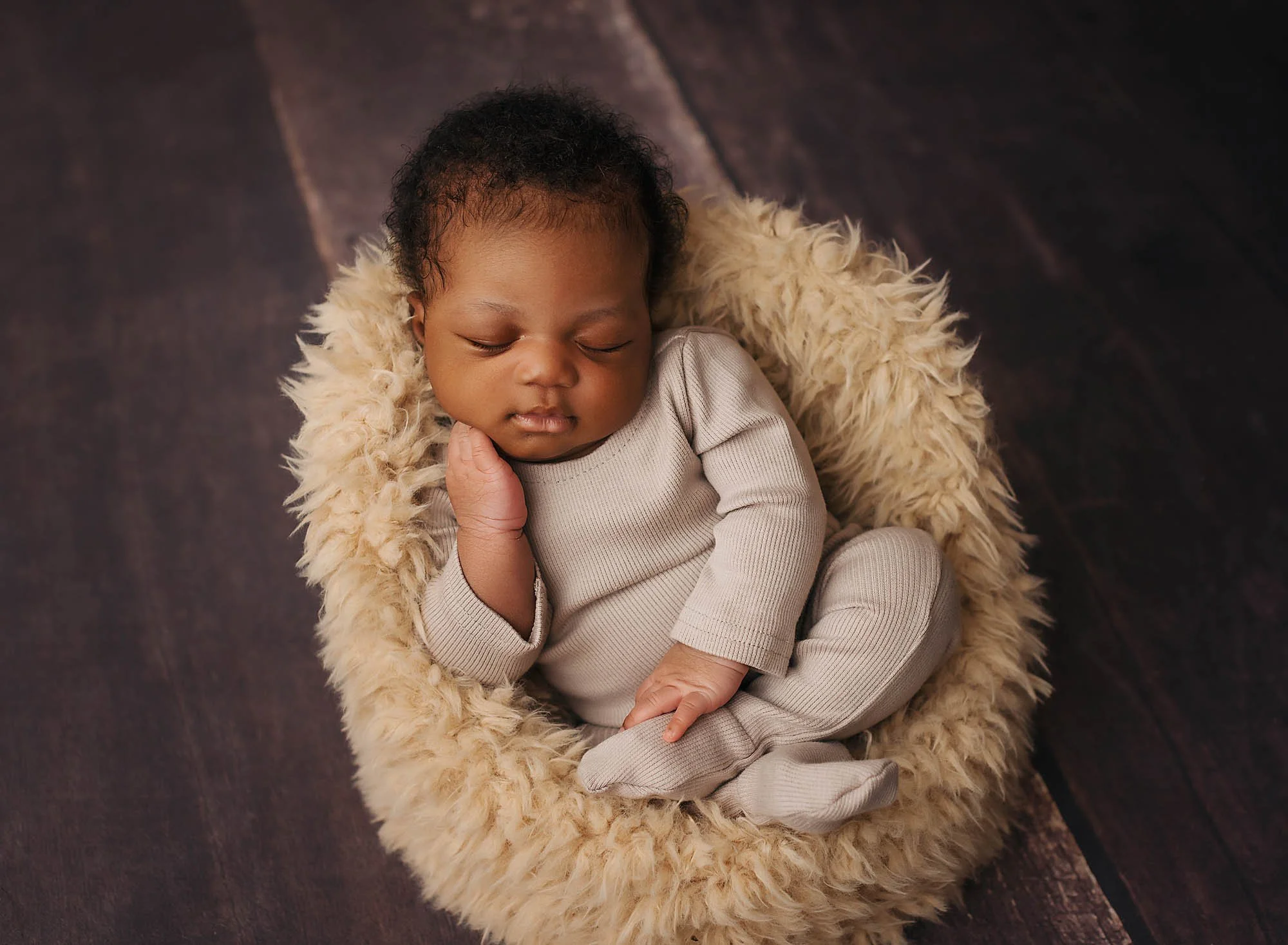 cute newborn in a chair 
