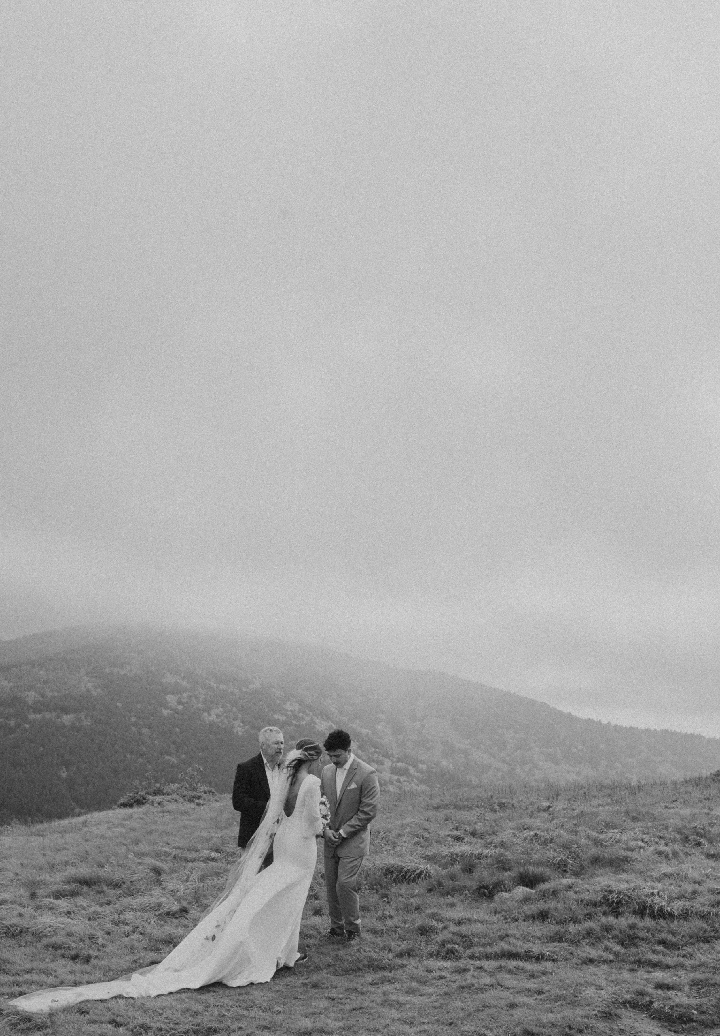 Rainy Appalachian mountain wedding with emotional vows