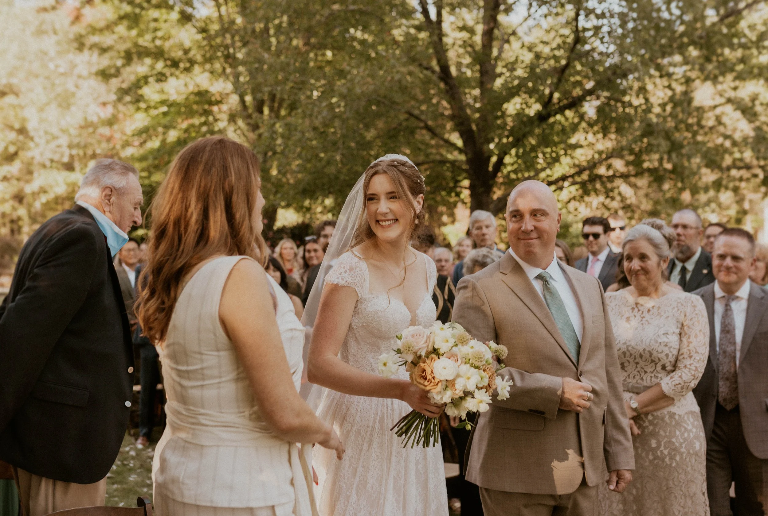 Emotional outdoor wedding ceremony at The Little Herb House in Raleigh, NC