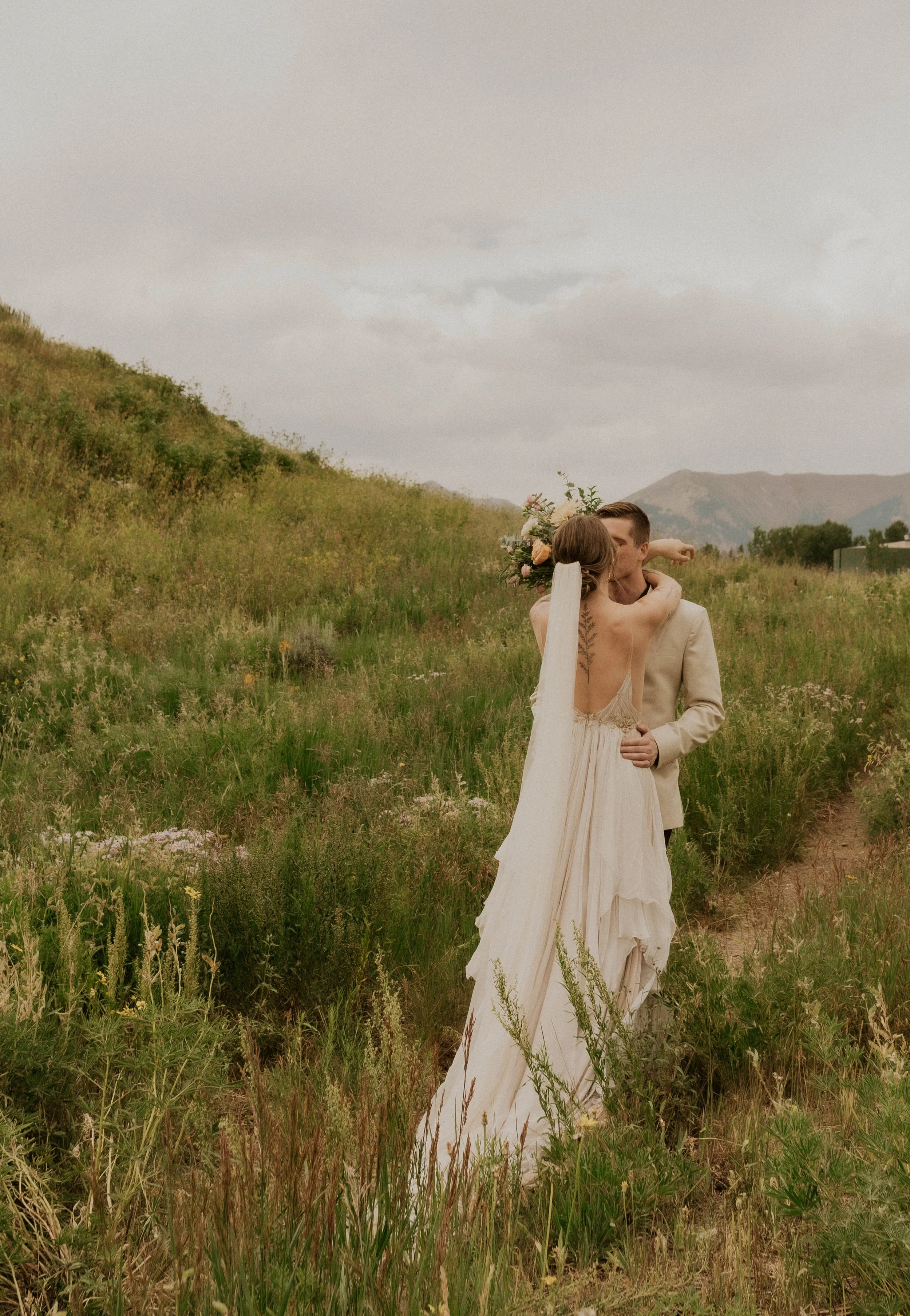 First look in a wildflower field near an aspen forest in Crested Butte