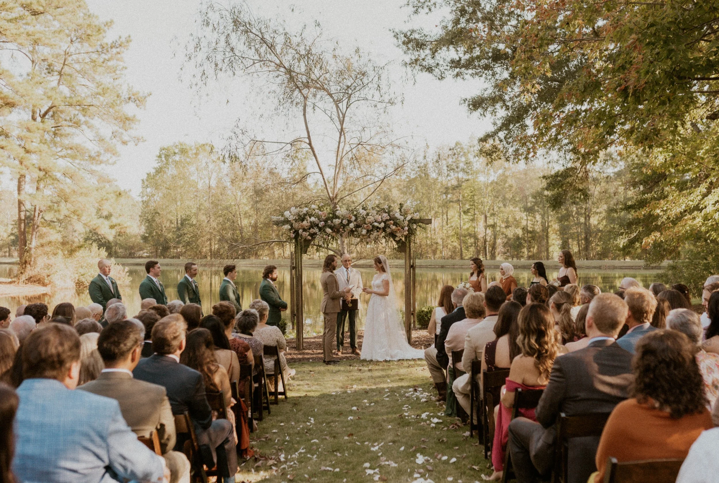 Emotional outdoor wedding ceremony at The Little Herb House in Raleigh, NC
